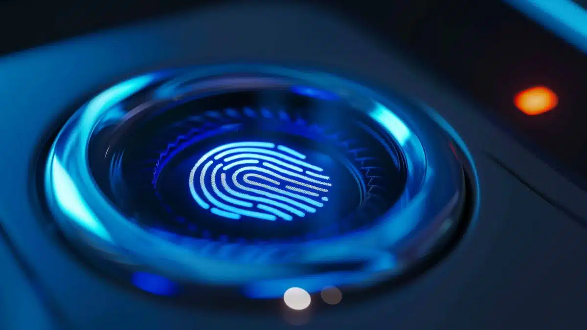Closeup of a fingerprint being scanned on the power button for authentication.