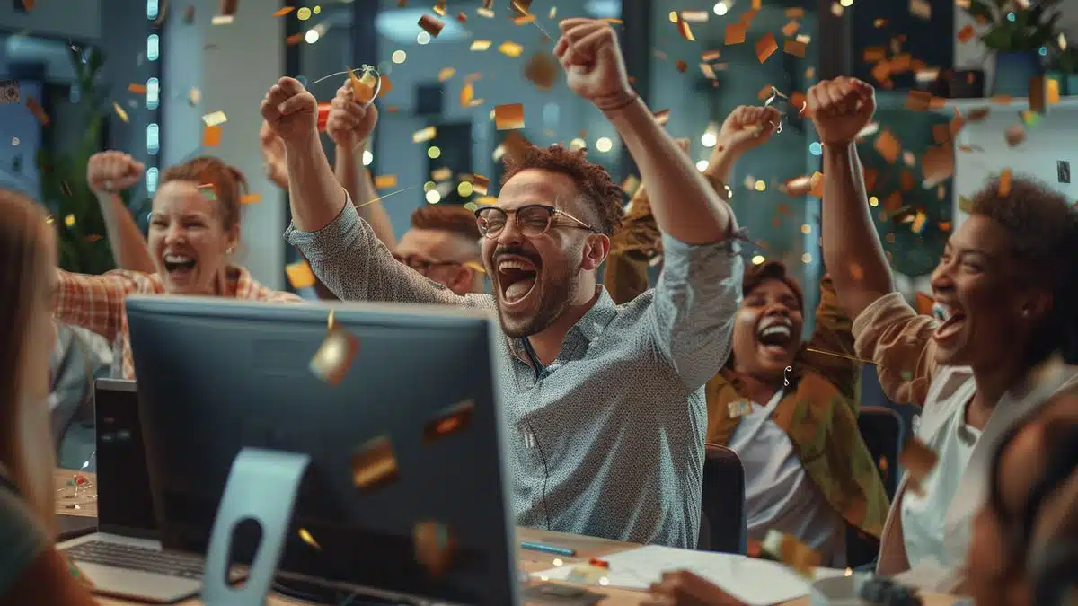 Group of coworkers celebrating their productivity boost thanks to Godealoffers.