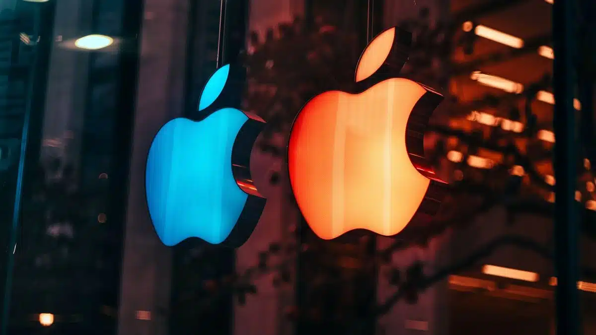 Closeup of Apple and Windows logos symbolizing intense competition in technology